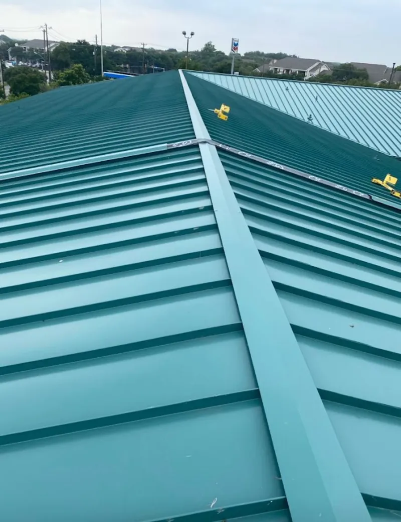 Green commercial metal roof ridge and valley for Metal Roof Repair in North Decatur