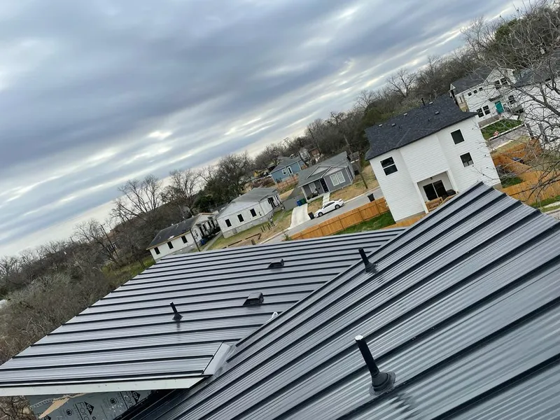 Standing seam metal roof panels with vents for Skylight Repair in North Decatur
